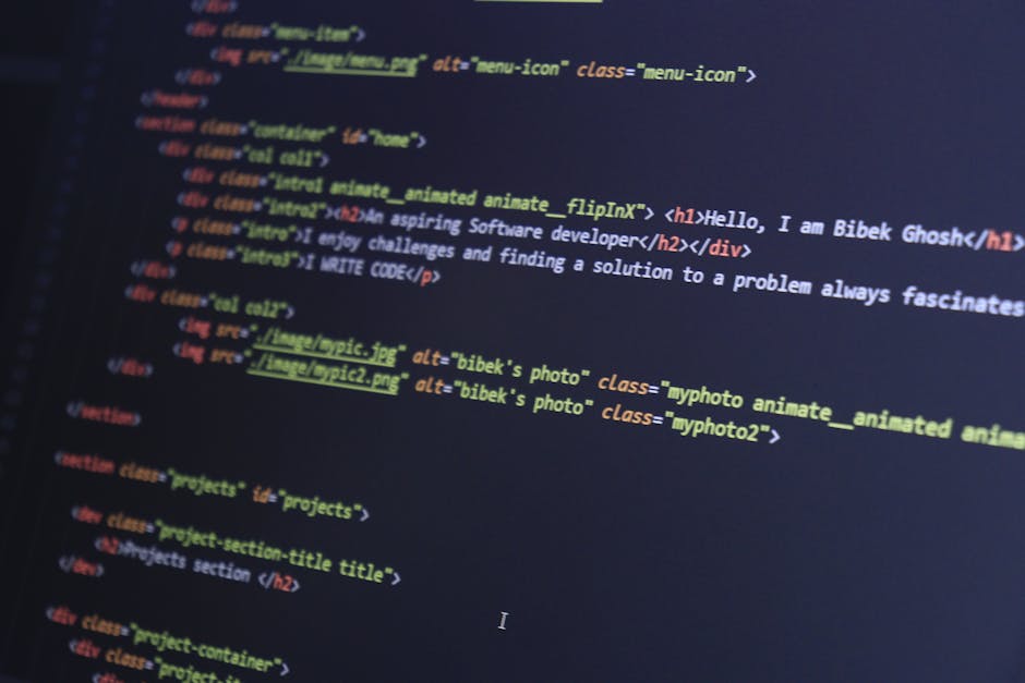 A detailed close-up of a computer screen displaying HTML code with colorful syntax highlighting, including tags and attributes related to web development. The code contains various elements such as <h